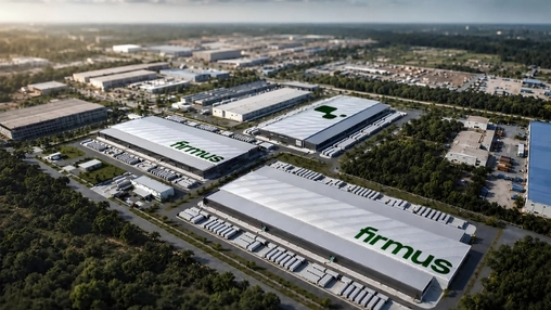 Aerial view of large Firmus branded warehouse rooftops within an industrial park surrounded by dense greenery